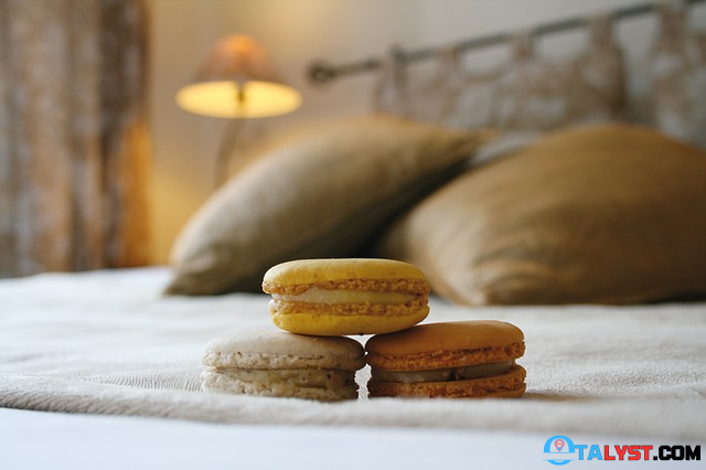 Macarons on a hotel bed