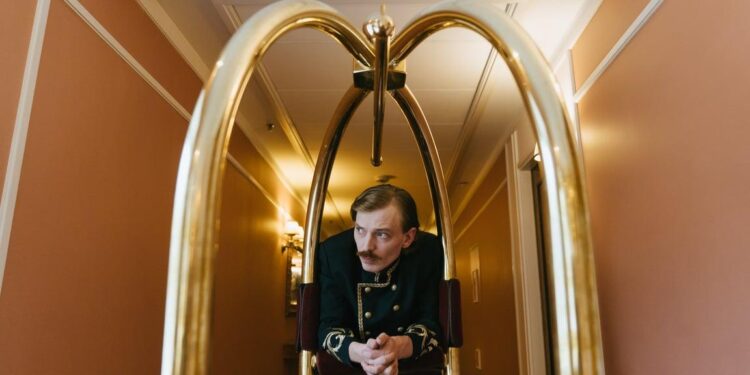 Hotel groom in corridor