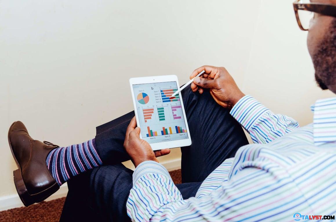 Man reviewing data on a tablet